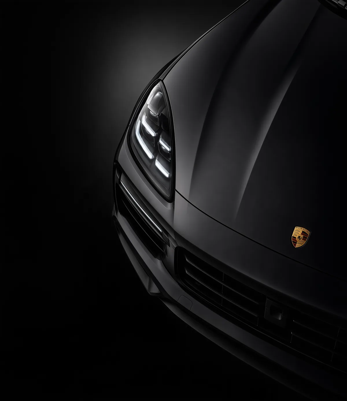 Front of a black Porsche with matte protection